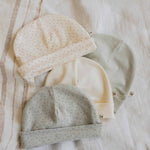 1+ In the Family baby hat Nuc in Ecru color