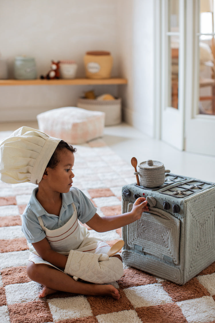 Kid playing with Lorena Canals Play Basket Kitchen