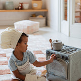 Kid playing with Lorena Canals Play Basket Kitchen