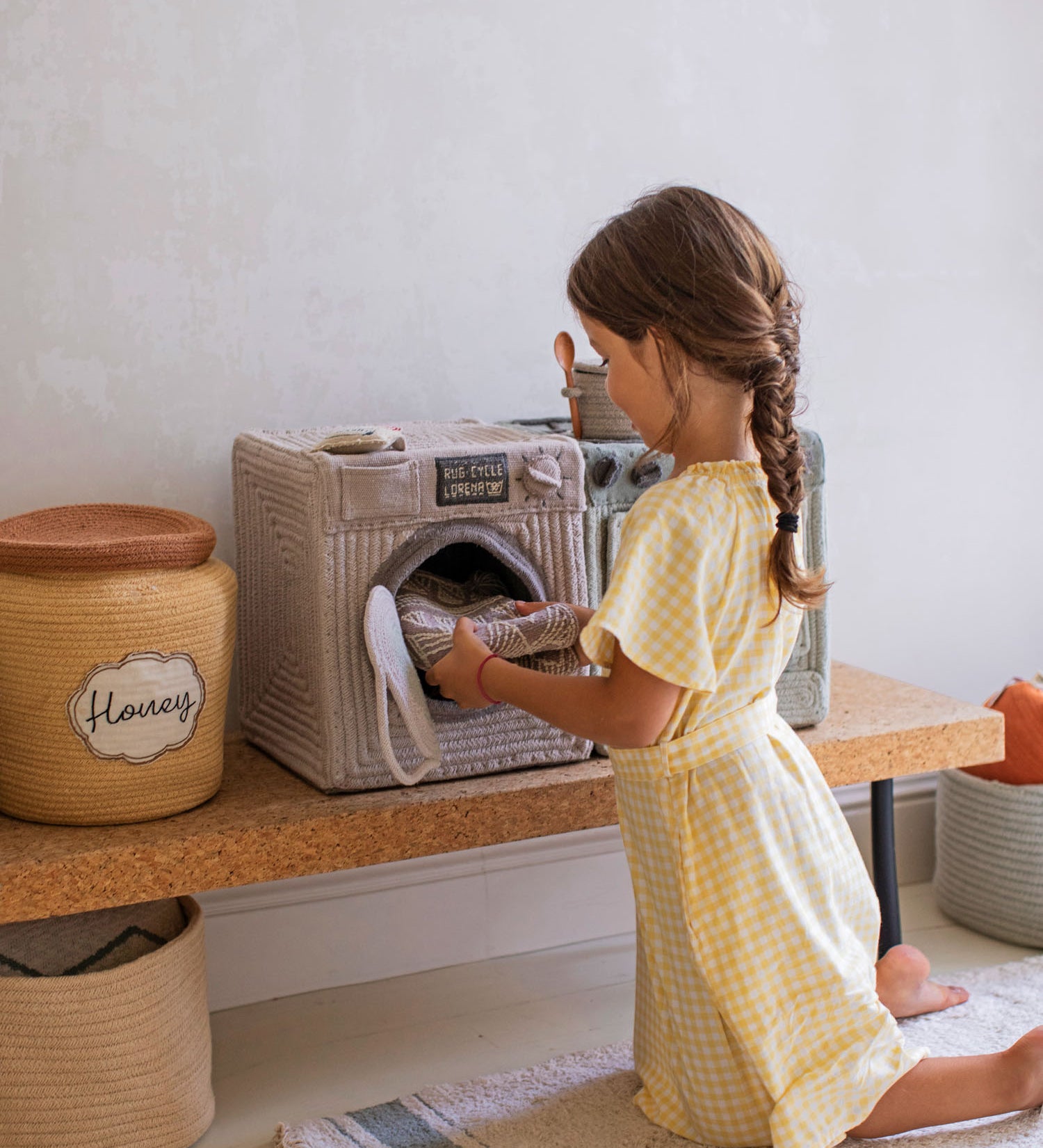 Girl with Lorena Canals Washing Machine basket