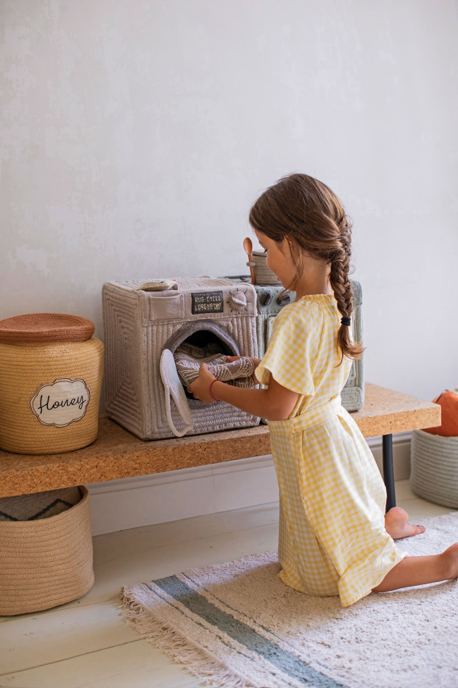 Girl with Lorena Canals Washing Machine basket
