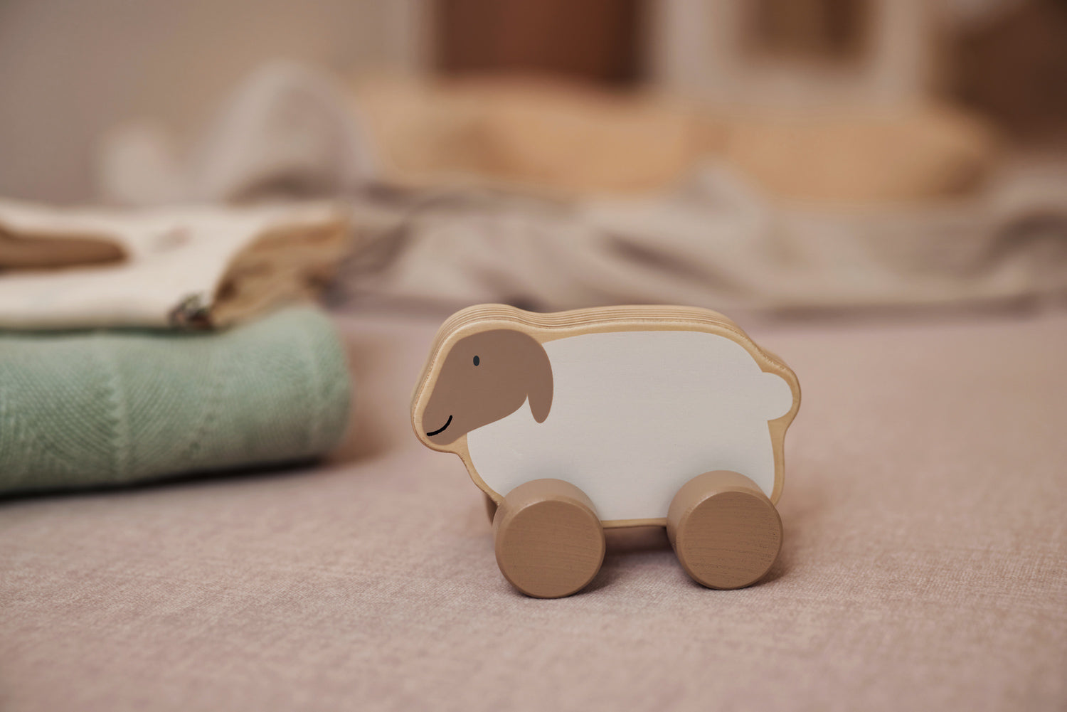 Jollein wooden toy car lamb on brown blanket