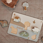 Jollein wooden puzzle farm on a blanket