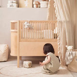 Jollein Musical soft toy Deepsea Seal on a baby crib