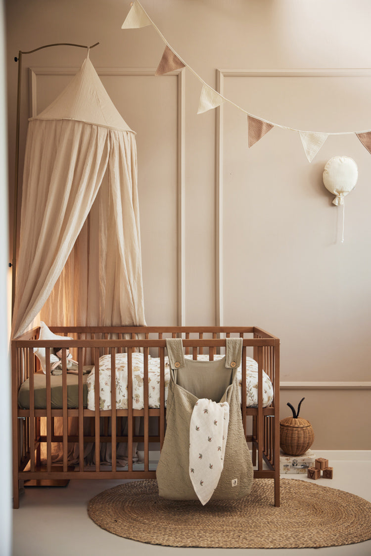 Jollein Canopy in Nougat in a nursery room above crib