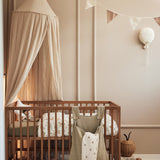 Jollein Canopy in Nougat in a nursery room above crib