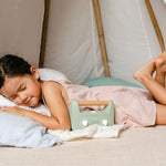 Kid in sun with the My Little Morphee Childrens Sleep and Meditation Box