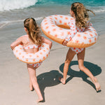 2 girls with Swim Essentials 55cm Swim Ring Flower Hearts