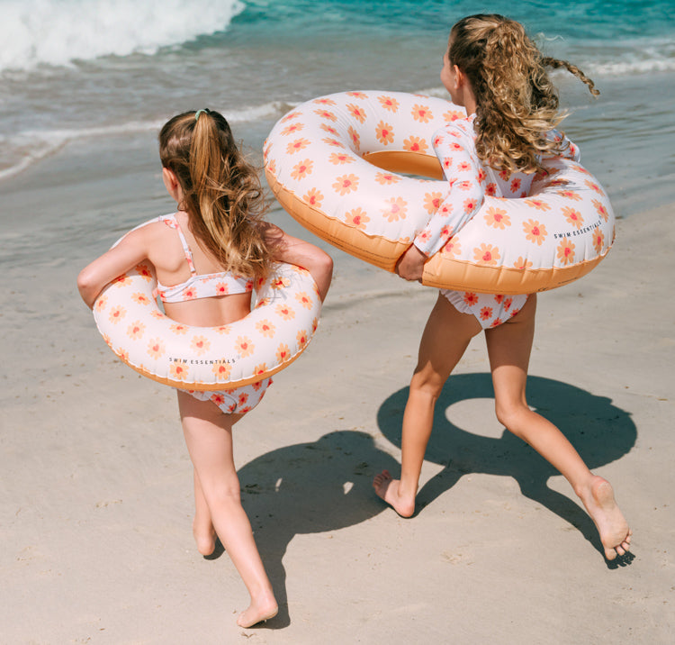 2 girls with Swim Essentials 55cm Swim Ring Flower Hearts
