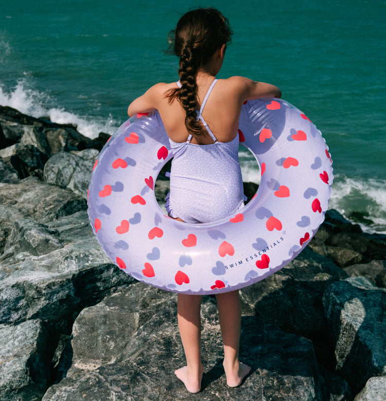 Girl with Swim Essentials 90cm Swim Ring Lilac Hearts Transparent