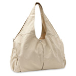 Jollein Urban diaper bag in Warm Sand, angled view with carry handles