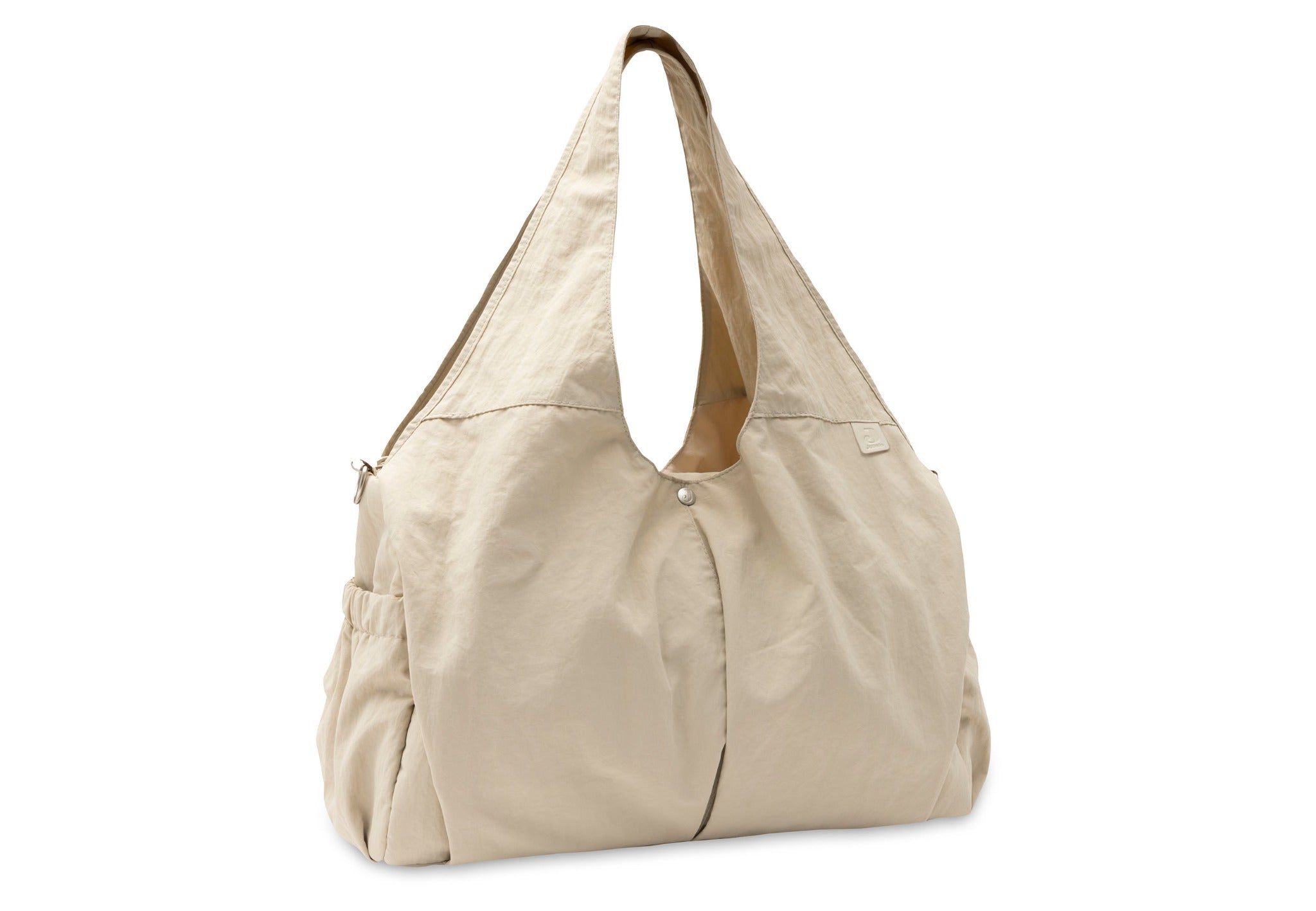 Jollein Urban diaper bag in Warm Sand, angled view with carry handles