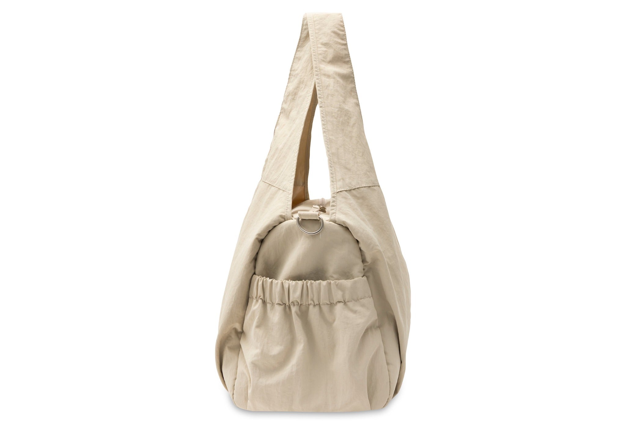 Jollein Urban diaper bag in Warm Sand, side view showing the gathered pocket