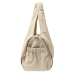 Jollein Urban diaper bag in Warm Sand, side view showing the gathered pocket