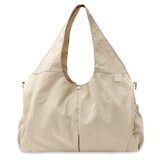 Jollein Urban diaper bag in Warm Sand with carry handles, front view