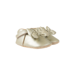 Donsje Celie baby shoes in Champagne Metallic Leather, with bow details, angled front view