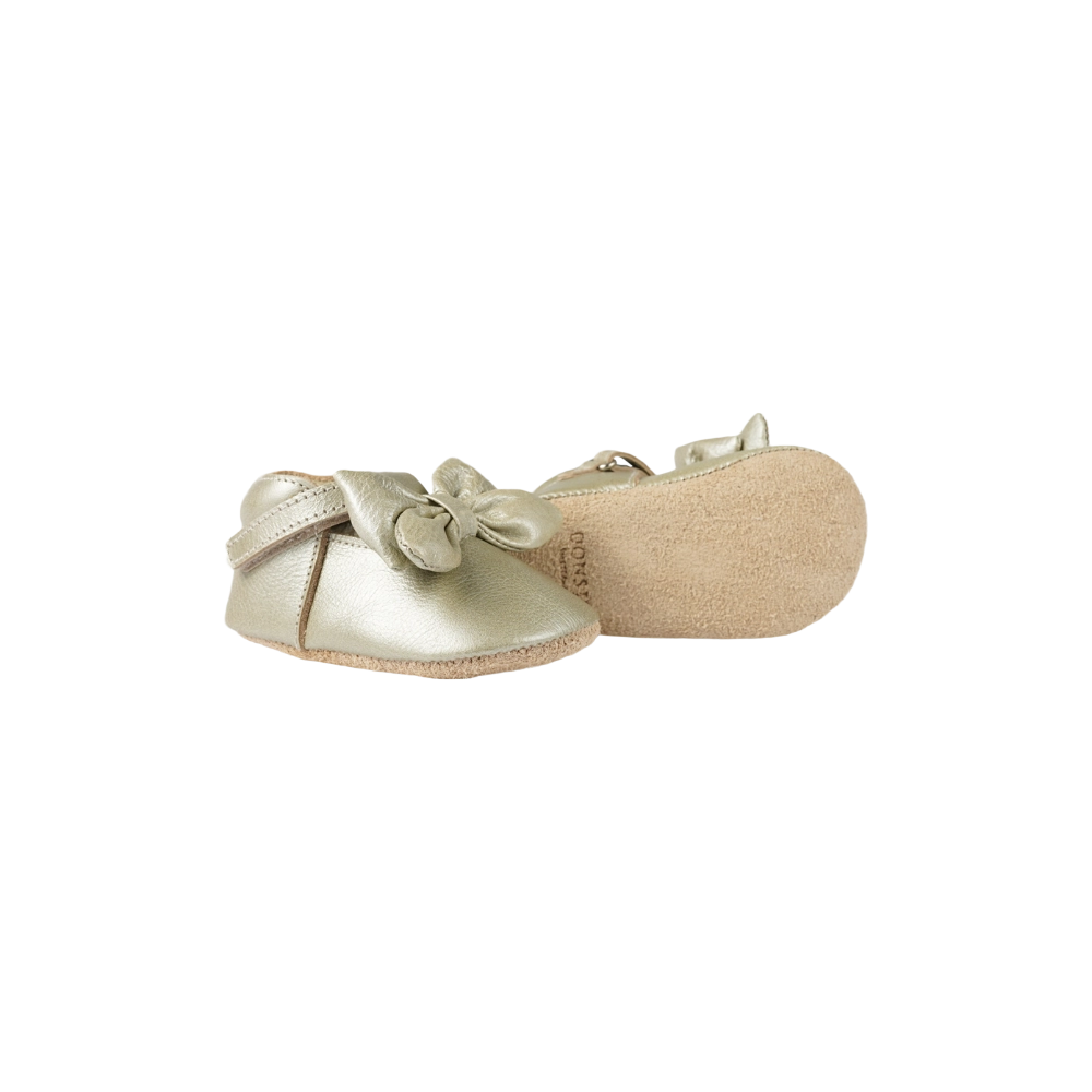 Donsje Celie baby shoes in Champagne Metallic Leather, side view showing the sole