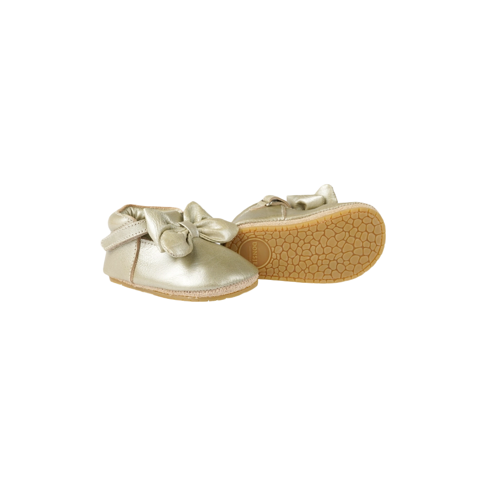 Donsje Celie baby shoes in Champagne Metallic Leather, side view showing the textured sole