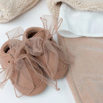 Donsje Lonny baby sneakers in Rose Dawn Classic Leather, with chiffon bows, styled product photograph