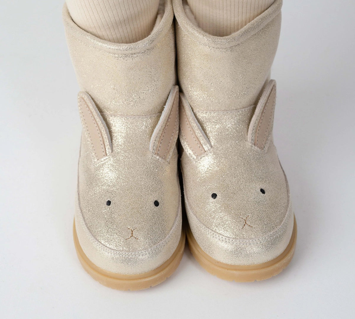 Donsje Xelly Bunny kids boots in Silver Metallic Leather, worn with cream tights, close-up