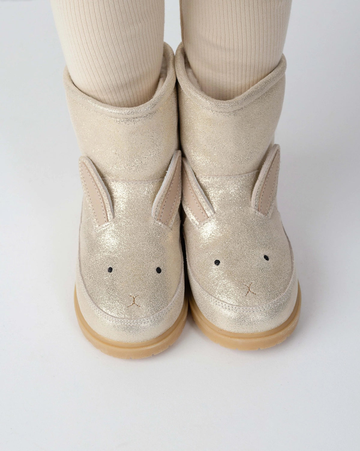 Donsje Xelly Bunny kids boots in Silver Metallic Leather, worn with cream tights, close-up