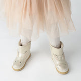 Donsje Xelly Bunny kids boots in Silver Metallic Leather, worn with a beige skirt