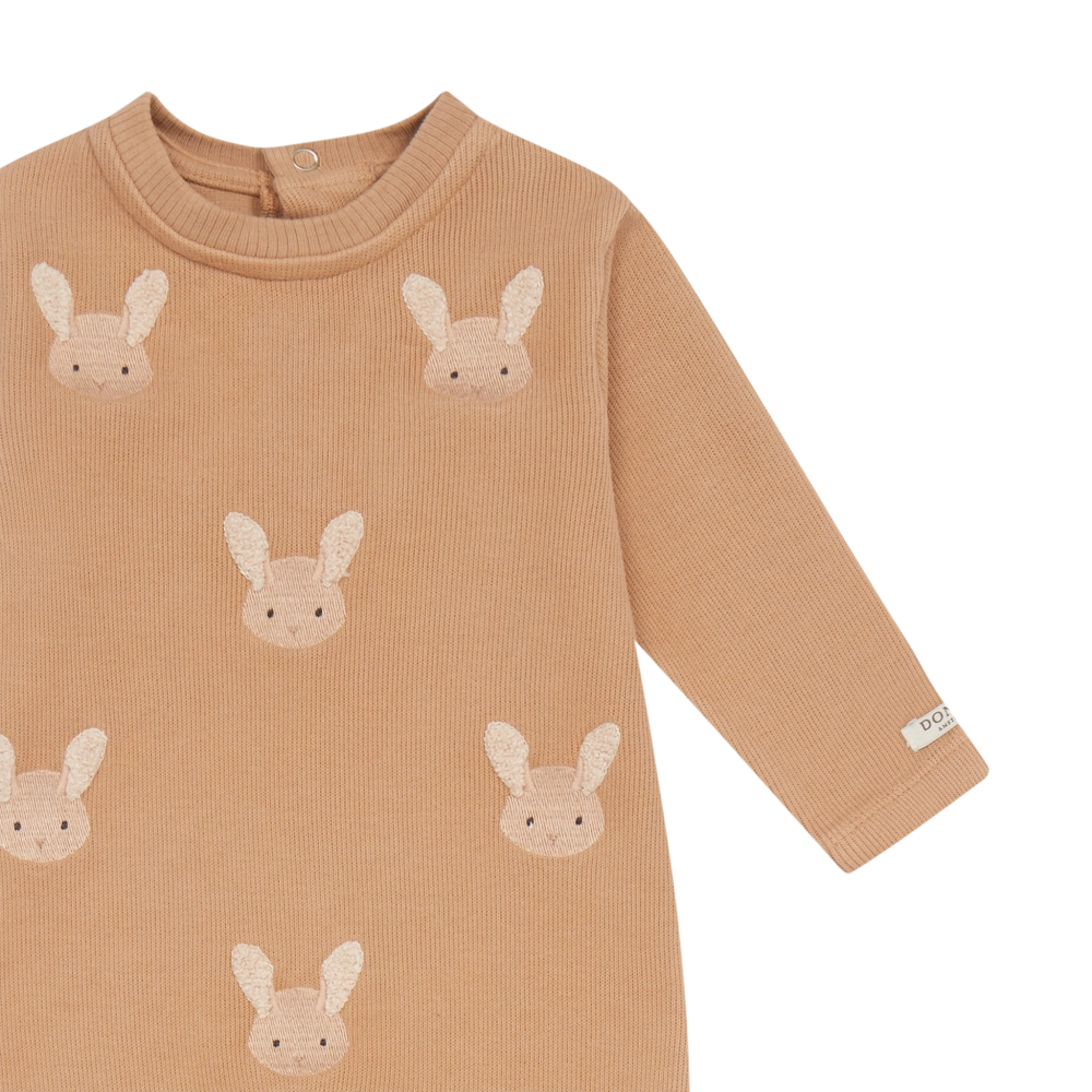 Donsje Phlyn Fluffy Bunnies onesie in Rose Mocha, close-up of the front and sleeve
