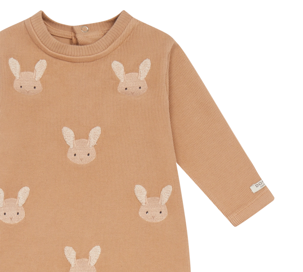 Donsje Phlyn Fluffy Bunnies onesie in Rose Mocha, close-up of the front and sleeve