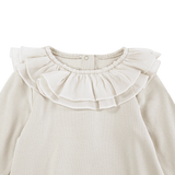 Donsje Fabien bodysuit in Birch, close-up of the ruffled collar