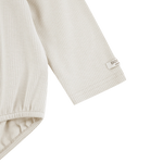 Donsje Fabien bodysuit in Birch, close-up of the sleeve and cuff