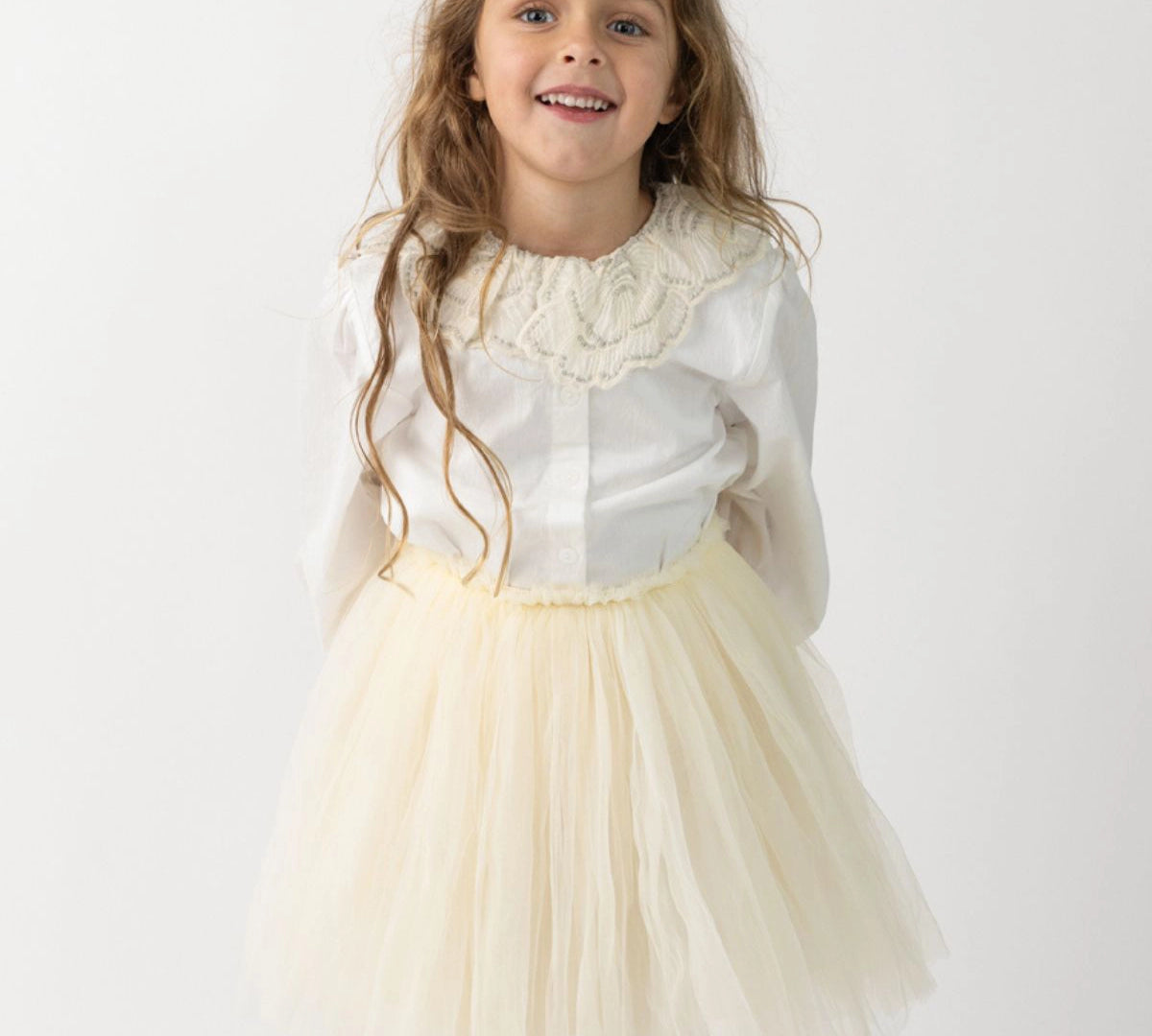 Donsje Kya skirt in Warm White, worn by a child with a white blouse
