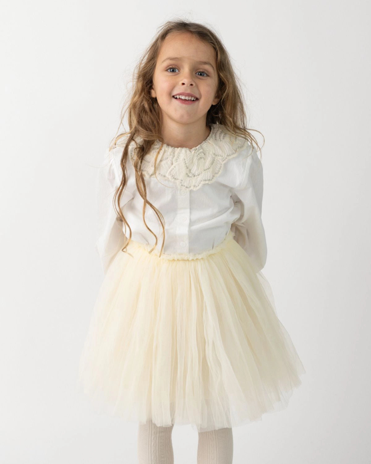 Donsje Kya skirt in Warm White, worn by a child with a white blouse