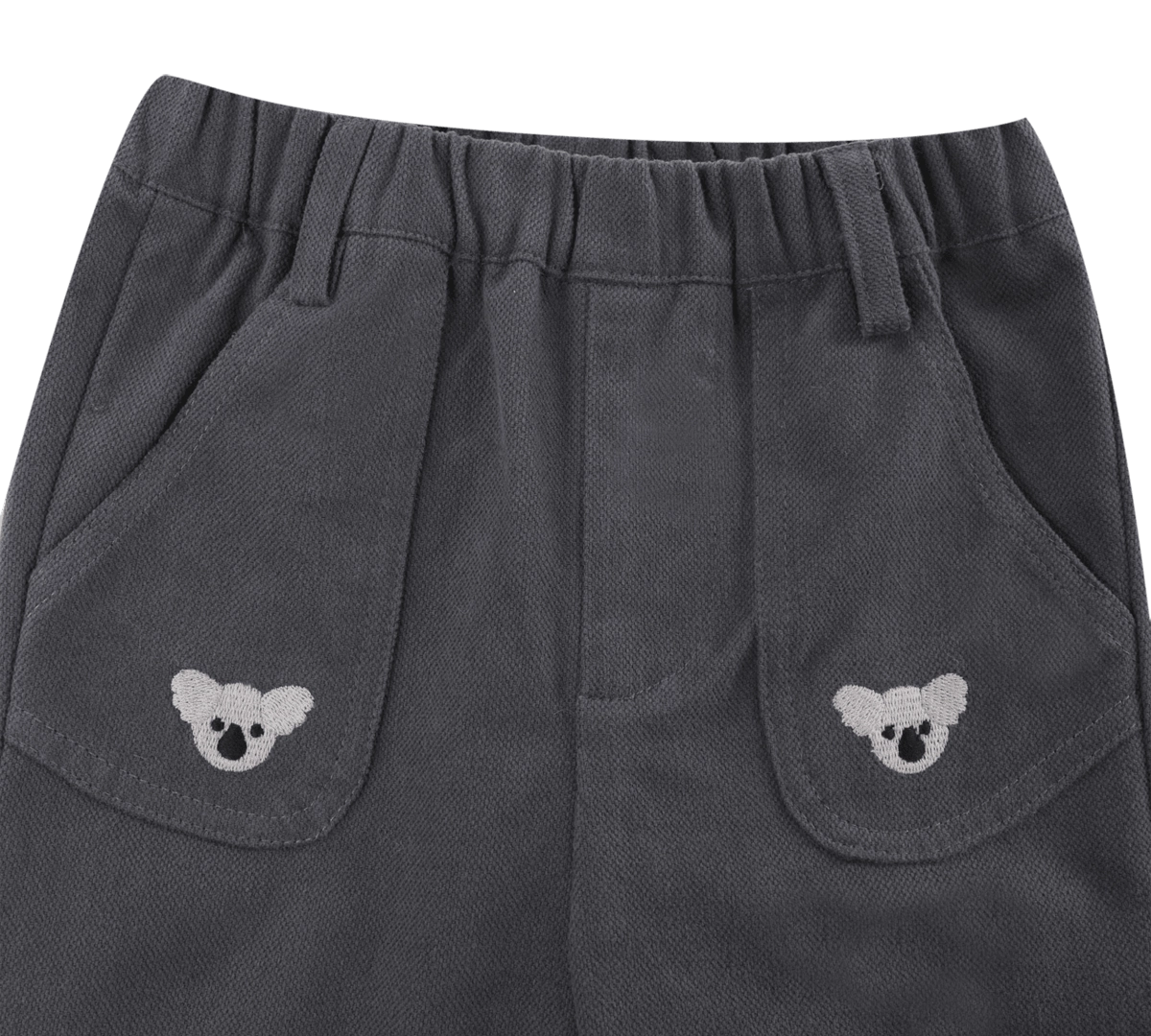 Donsje Kassim Koala trousers in Cloudy Grey, close-up of the waistband and koala pockets