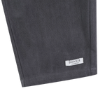 Donsje Kassim Koala trousers in Cloudy Grey, close-up of the hem and brand label