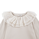 Donsje Florentien top in Birch, close-up of the ruffled collar