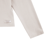 Donsje Florentien top in Birch, close-up of the sleeve and brand label