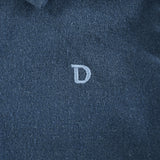 Donsje Chee shirt in Night Blue, close-up of the embroidered D detail