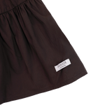 Donsje Azani skirt in Toffee, close-up of the hem and brand label