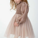 Donsje Janice dress in Rose Brown, worn by a child, angled view