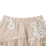 Donsje Kubwa skirt in Soft Powder with White Blossom, close-up of the waistband and floral details