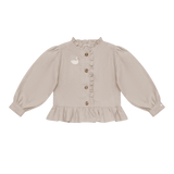 Donsje Siles Swan blouse in Soft Taupe, front view with ruffle and swan details