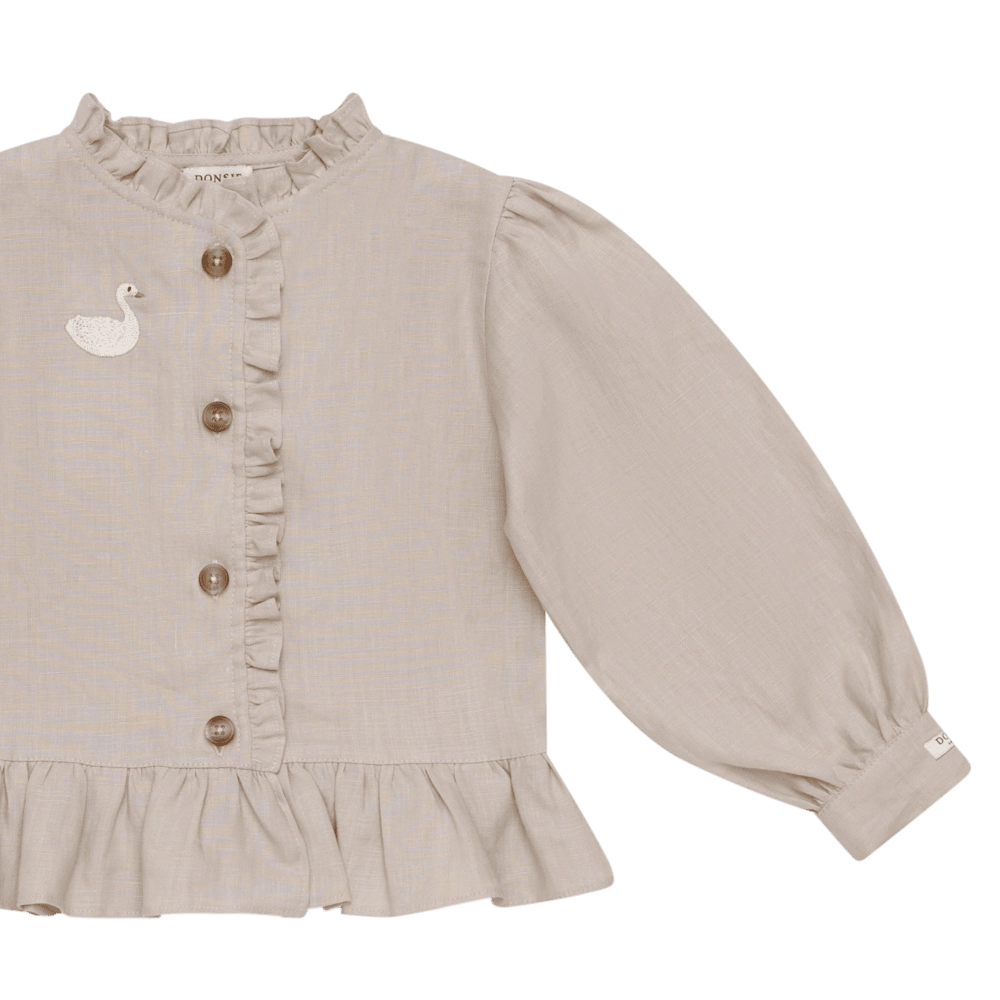 Donsje Siles Swan blouse in Soft Taupe, close-up of the front and sleeve