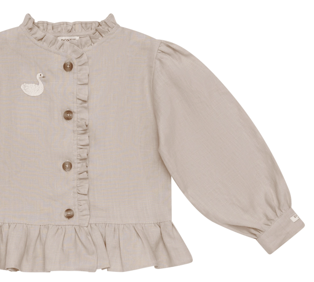 Donsje Siles Swan blouse in Soft Taupe, close-up of the front and sleeve