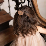 Donsje Pouty Fluffy Bear hairclip in Teddy Brown Suede, worn in a child's hair