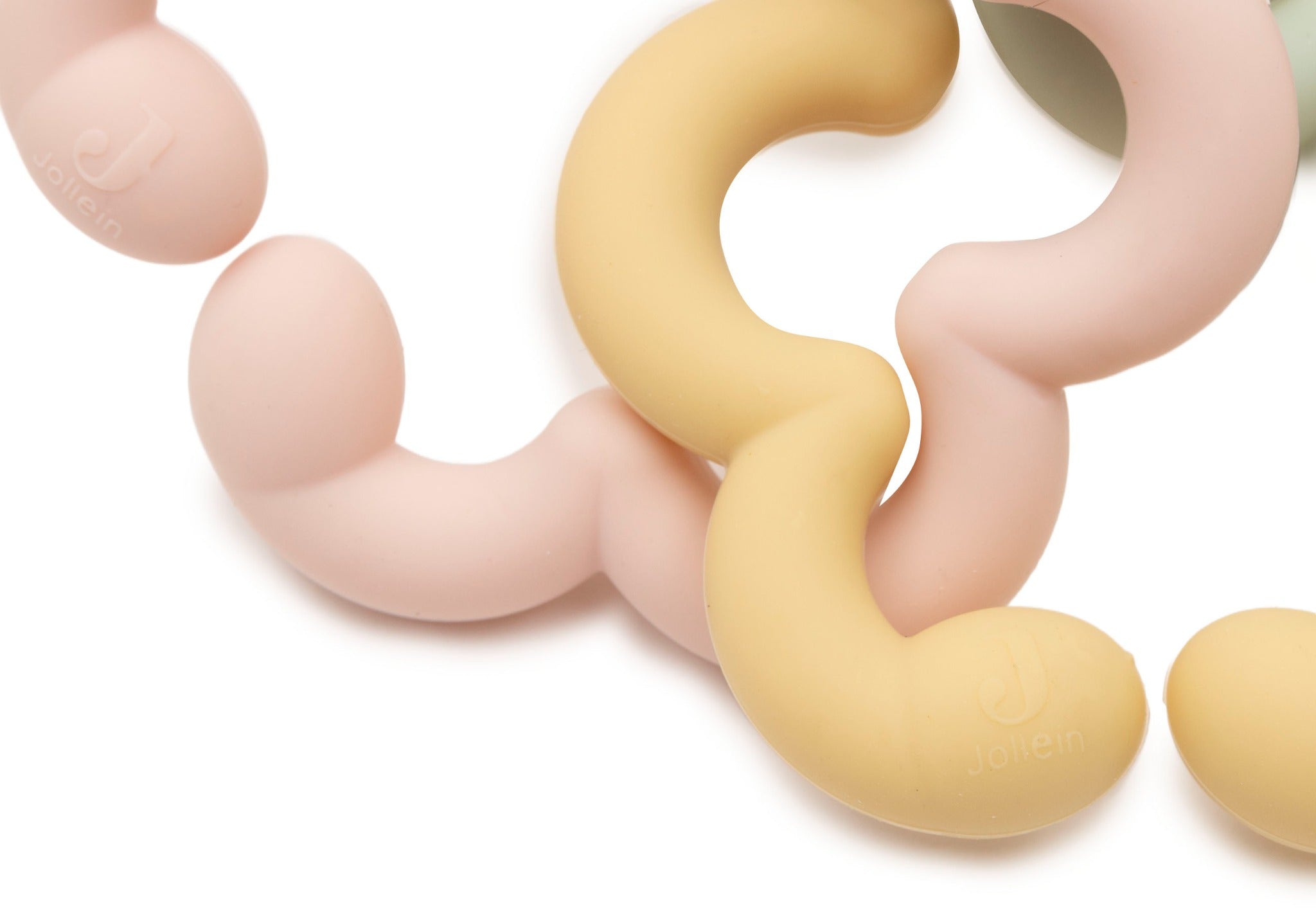 Close-up of the openings in Jollein silicone flower toy loops in pink, yellow and green