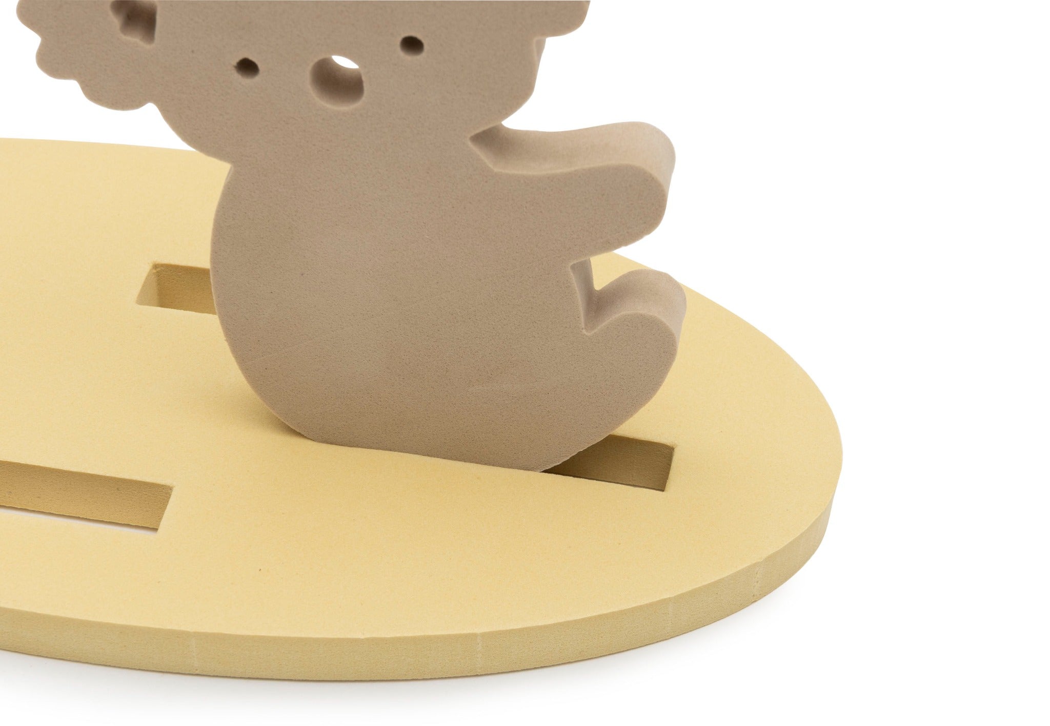 Close-up of a koala figure fitted into a yellow floating base from the Jollein Kangaroots bath foam playset