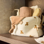 Jollein Little Waffle Mini Teddy Bear pouch holding care essentials on a shelf