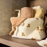 Jollein Little Waffle Mini Teddy Bear pouch holding care essentials on a shelf
