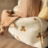 Jollein Little Waffle Mini Teddy Bear pouch with towels and a brush, angled view