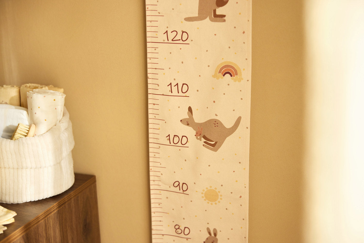 Close-up of the Jollein Kangaroots growth chart hanging on a nursery wall